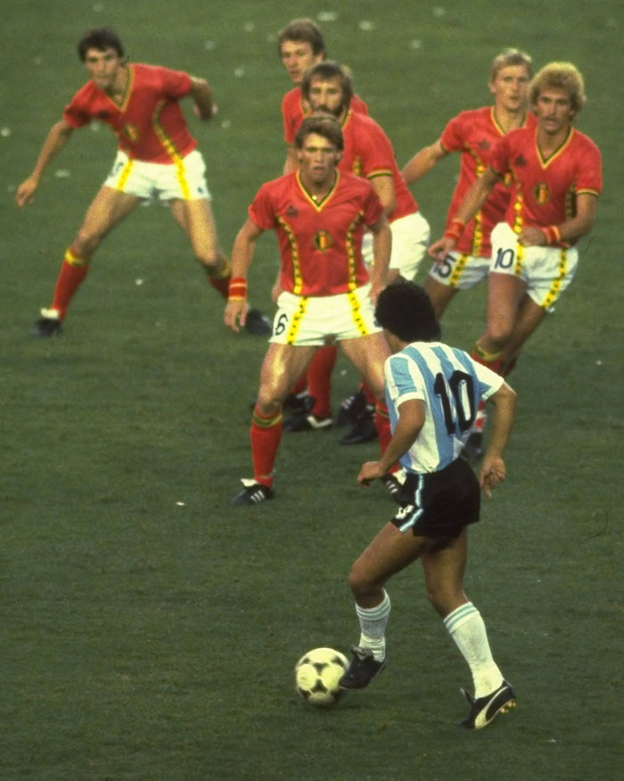 Diego Maradona taking on six Belgium players