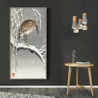 Heron on snowy tree branch by Ohara Koson