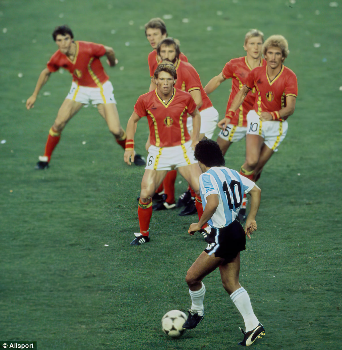 Diego Maradona taking on six Belgium players