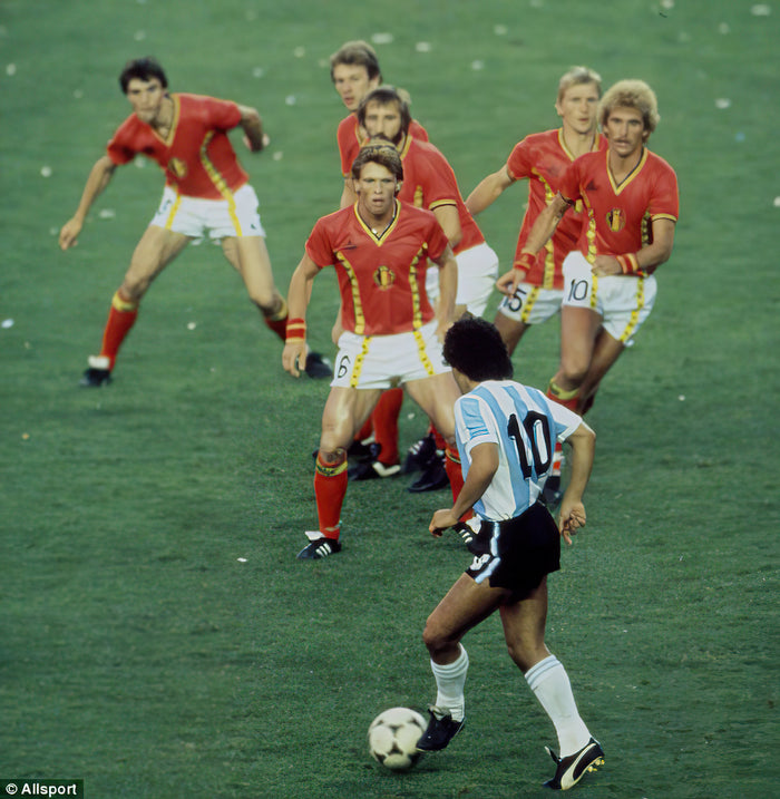 Diego Maradona taking on six Belgium players